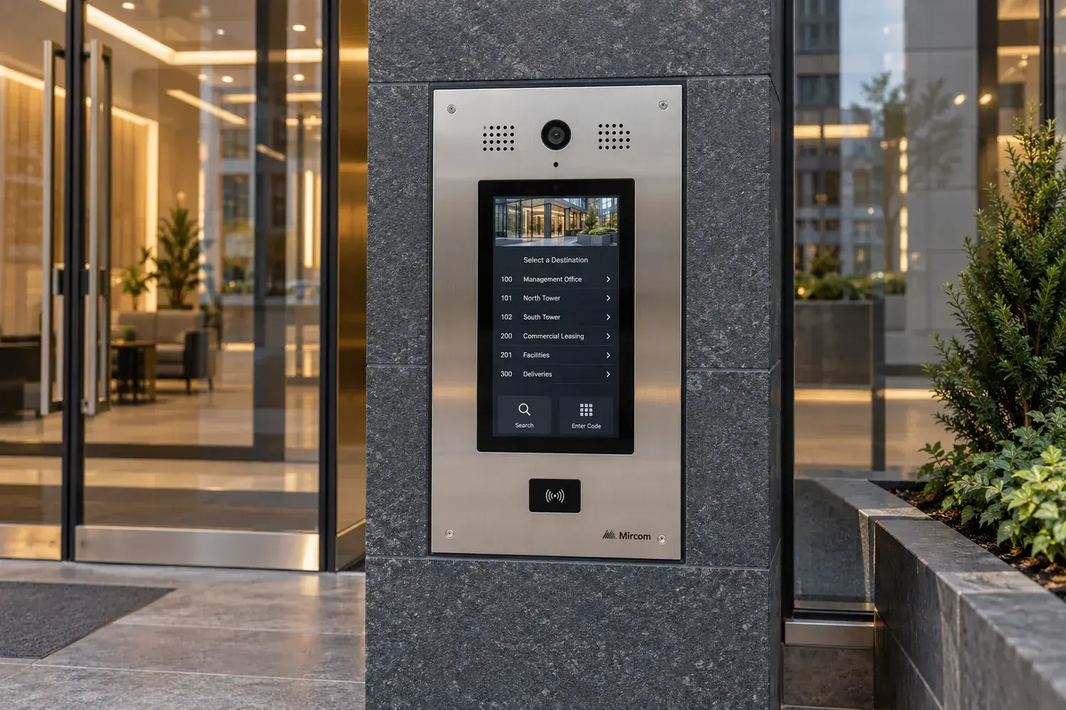 Illustrative modern touchscreen intercom mounted beside a contemporary glass entrance